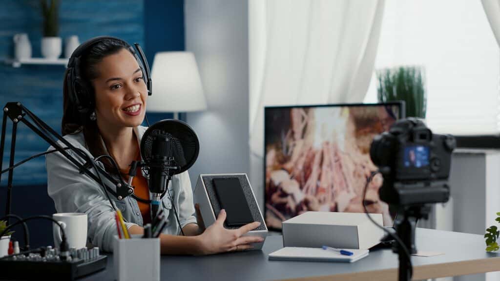 Woman talking into microphone - Accounting for content creators in Dallas, Texas